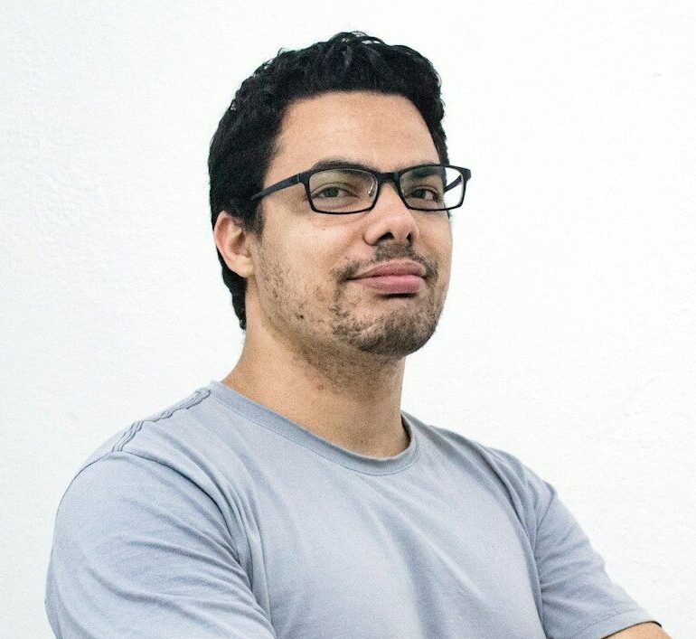 man crossing both arms